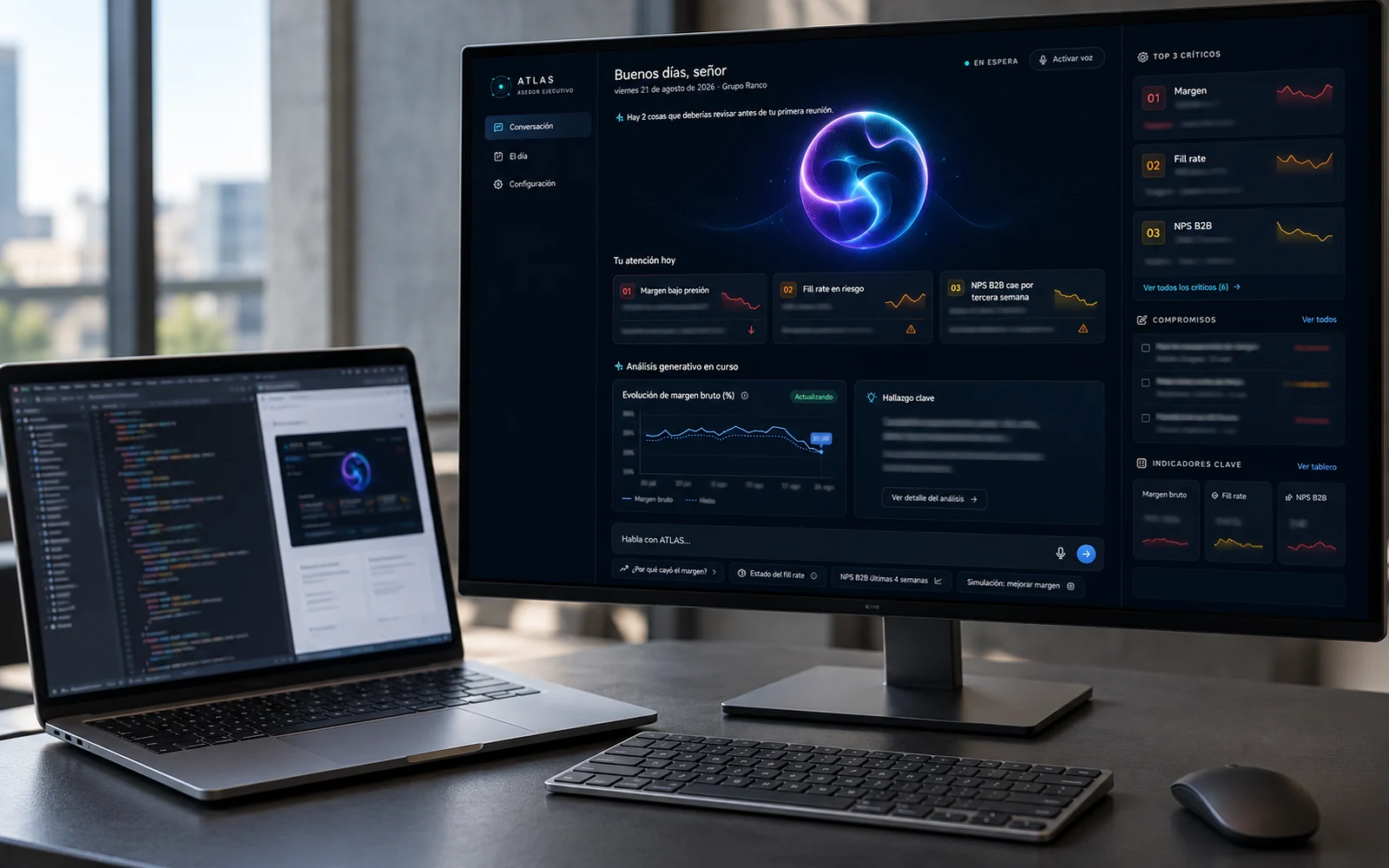 Visualización de un espacio de desarrollo con un prototipo en el monitor y un editor de código en el portátil